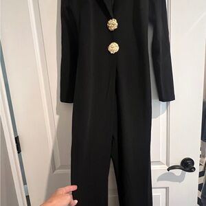 Chic Black Jumpsuit with Long Sleeves and Gold Details